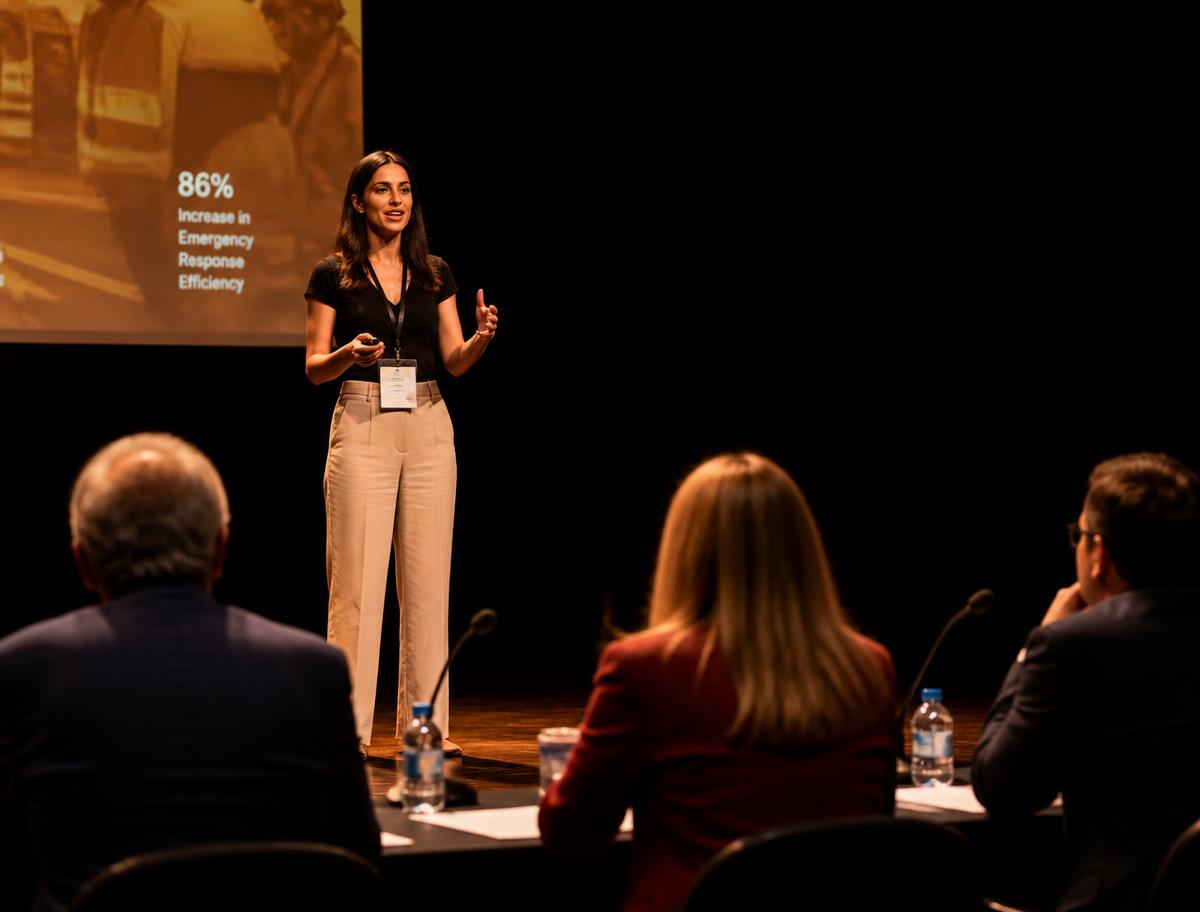 A founder pitching her business to a judging panel